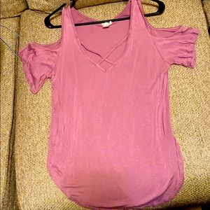 Pink blouse with shoulder holes.